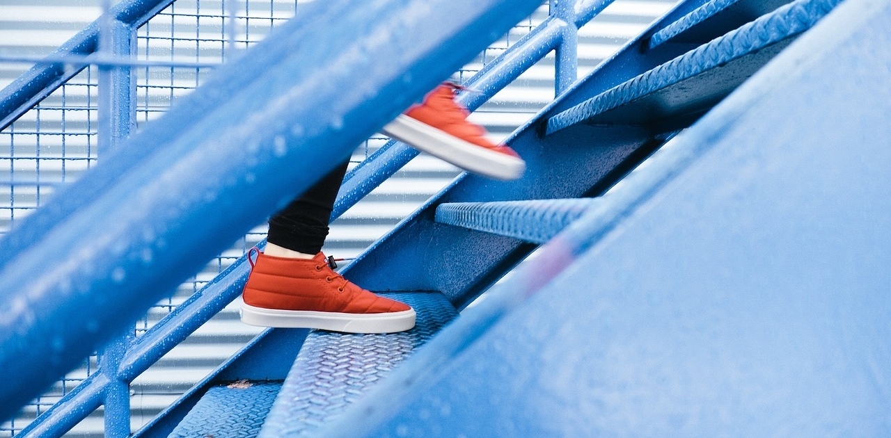 man stepping up stairs