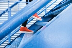 man stepping up stairs